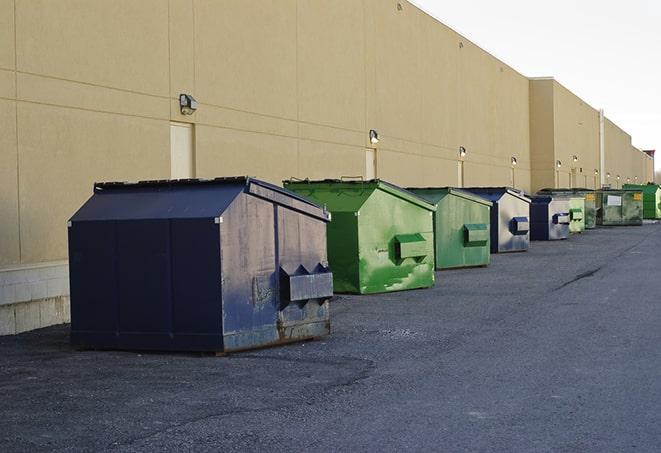 construction dumpsters stacked in a row on a job site in Groesbeck, OH